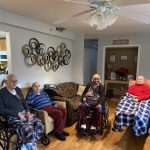 Residents relaxing in furnished common room